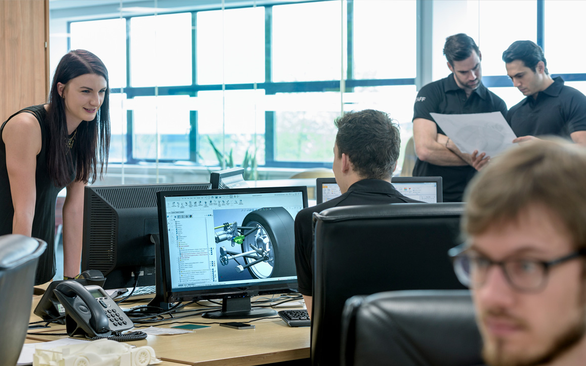 Open workspace with engineers collaborating on projects