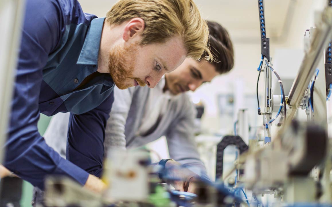 Engineers bench testing automotive components