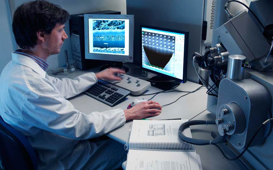 Employee analyzes automotive component performance