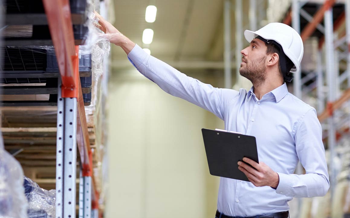 SPW parts supply chain management Man in hard hat doing inventory