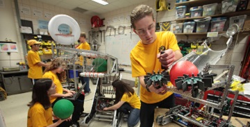 Young people working in an engineering lab